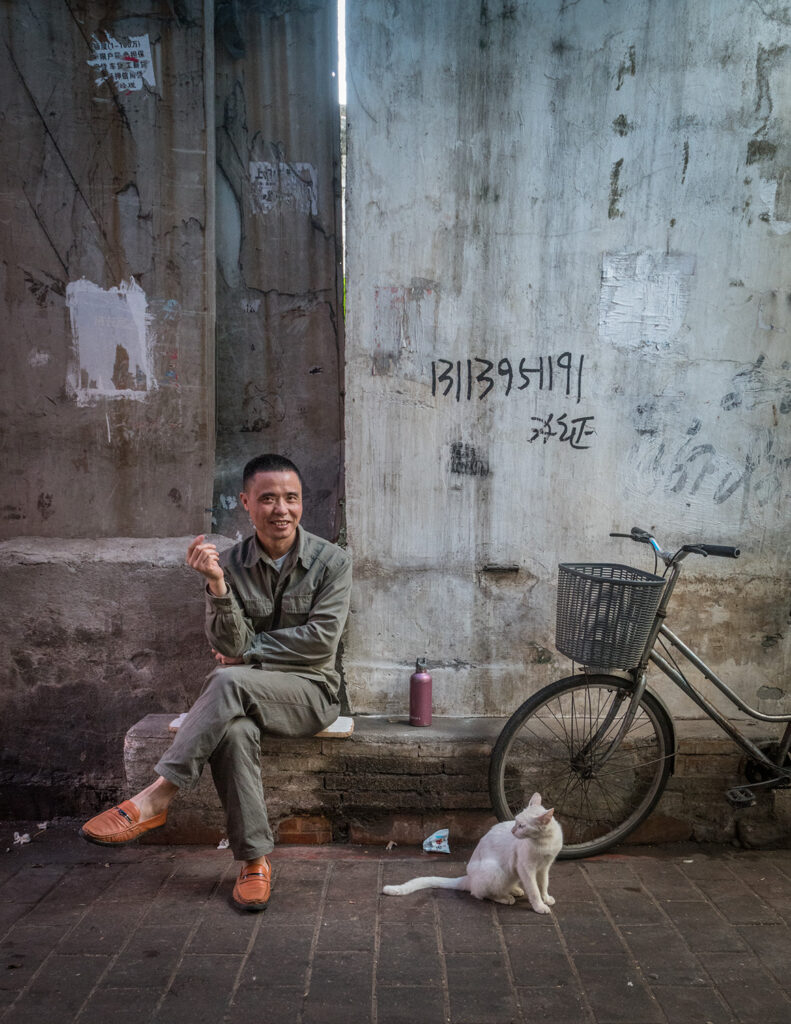 a cat from China and his owner