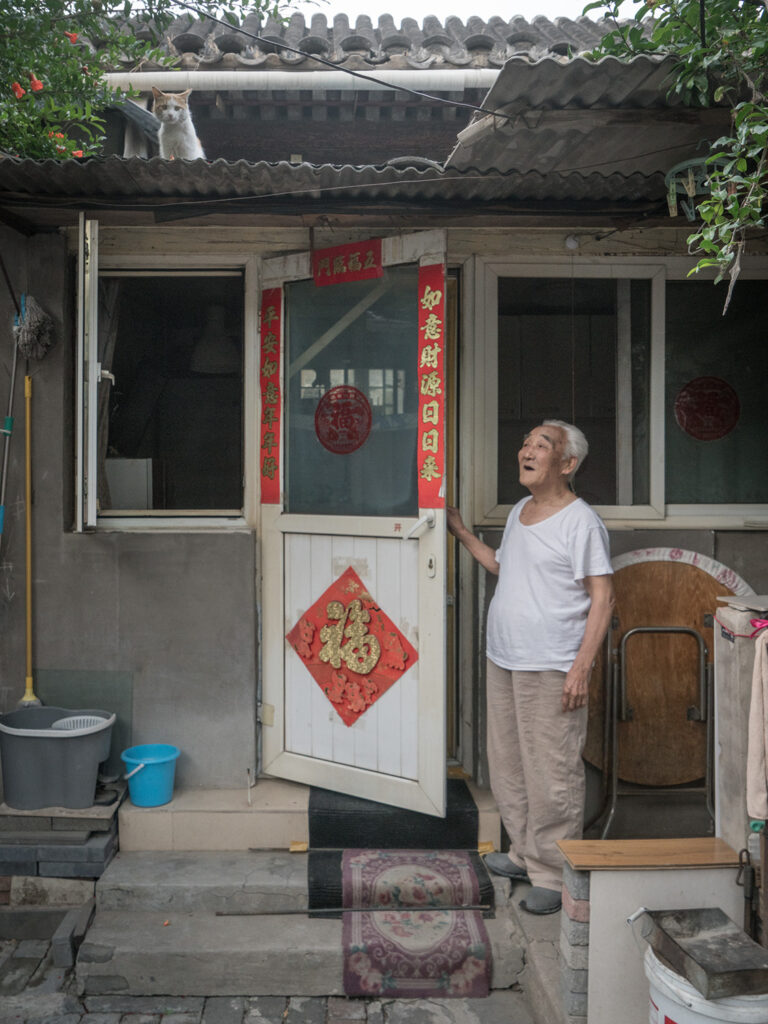 elderly Chinese man with his cat